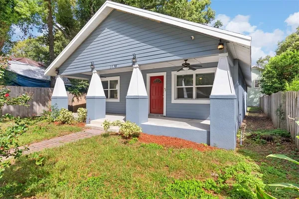 front view of a house with a yard