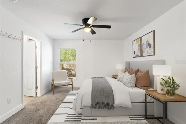 a bedroom with a bed and window