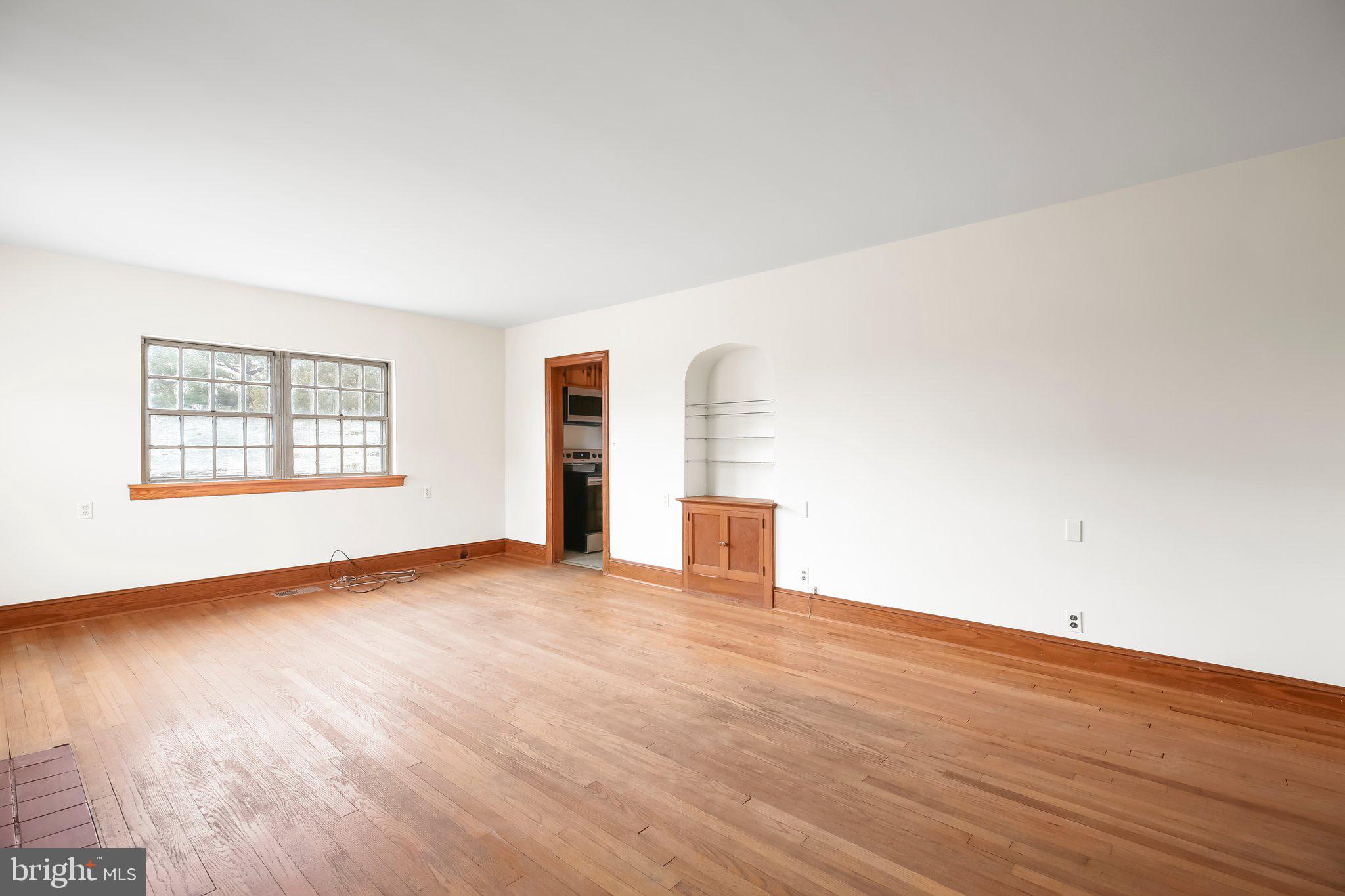19192 Partlow Road Beaverdam, VA 23015 - Photo 5 of 26 an empty room with wooden floor and windows