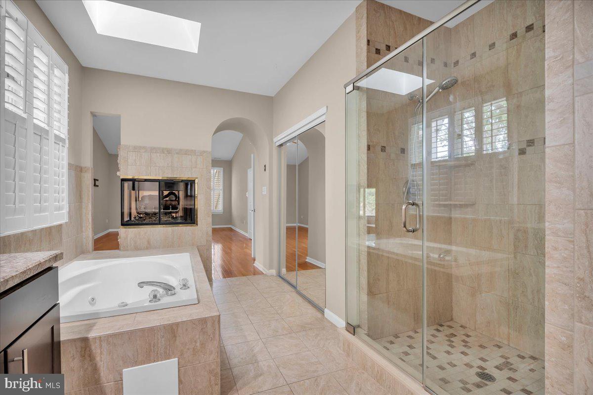 5 Promenade Place Voorhees, NJ 08043 - Photo 18 of 24 a bathroom with a sink a toilet and shower