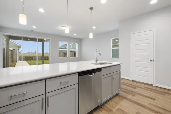 a kitchen with a sink and large window