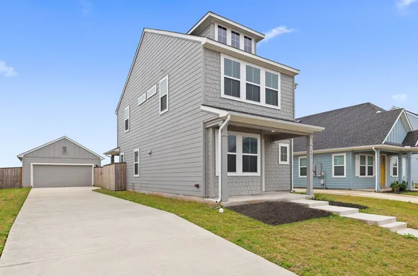 a front view of a house with swimming pool and porch