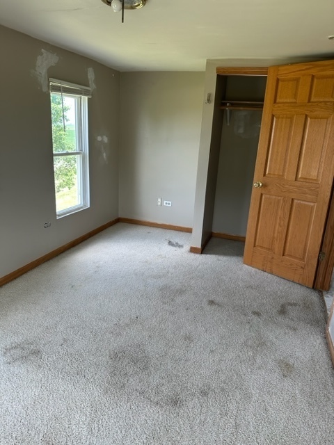 741 Sterling Road Dixon, IL 61021 - Photo 13 of 21 an empty room with windows and closet