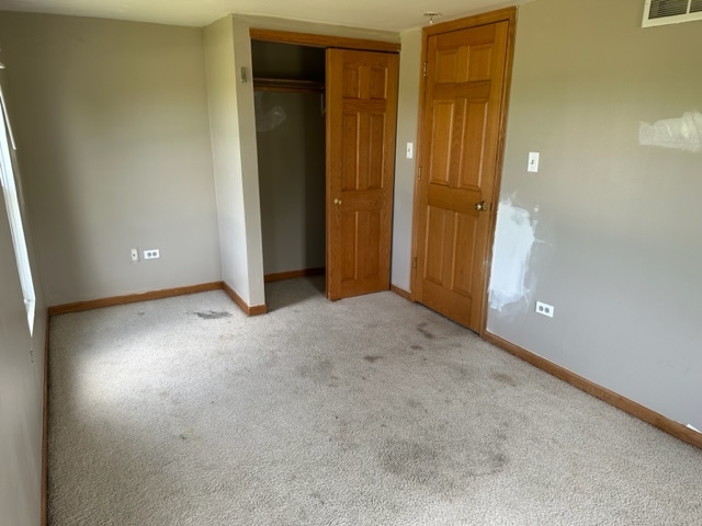 741 Sterling Road Dixon, IL 61021 - Photo 15 of 21 an empty room with closet area