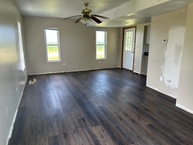 741 Sterling Road Dixon, IL 61021 - Photo 9 of 21 an empty room with wooden floor and windows