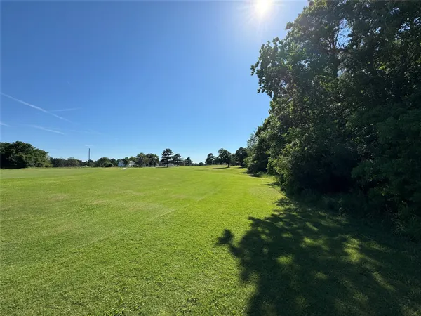 a view of lake with green space