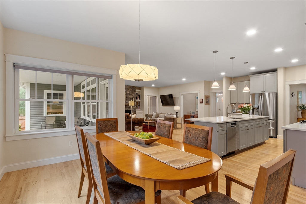 243 Gates Pond Road Berlin, MA 01503 - Photo 11 of 40 a view of a dining room with furniture window and wooden floor
