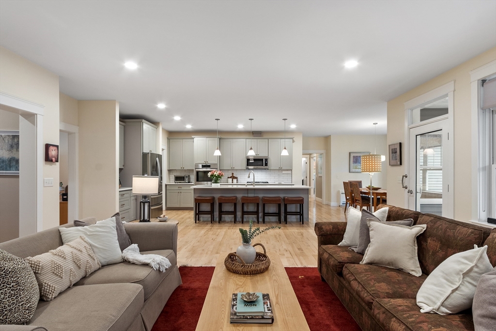 243 Gates Pond Road Berlin, MA 01503 - Photo 14 of 40 a living room with furniture kitchen and a table