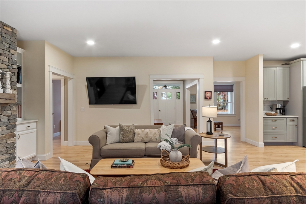 243 Gates Pond Road Berlin, MA 01503 - Photo 15 of 40 a living room with furniture and a flat screen tv