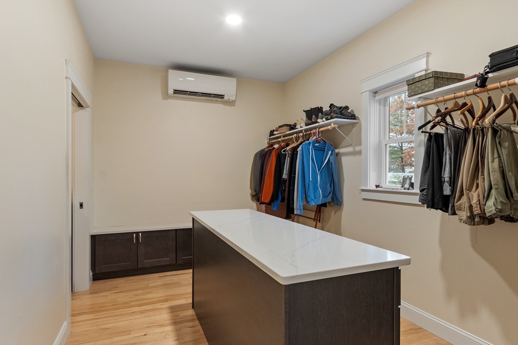 243 Gates Pond Road Berlin, MA 01503 - Photo 27 of 40 a view of walk in closet with clothes and shoes