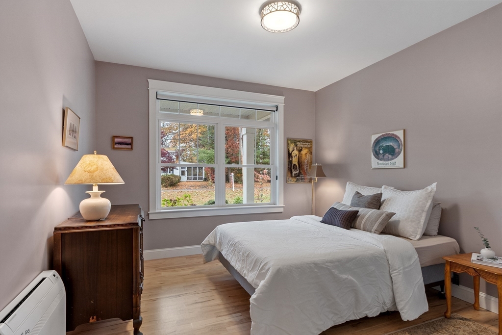 243 Gates Pond Road Berlin, MA 01503 - Photo 29 of 40 a bedroom with a bed and a window