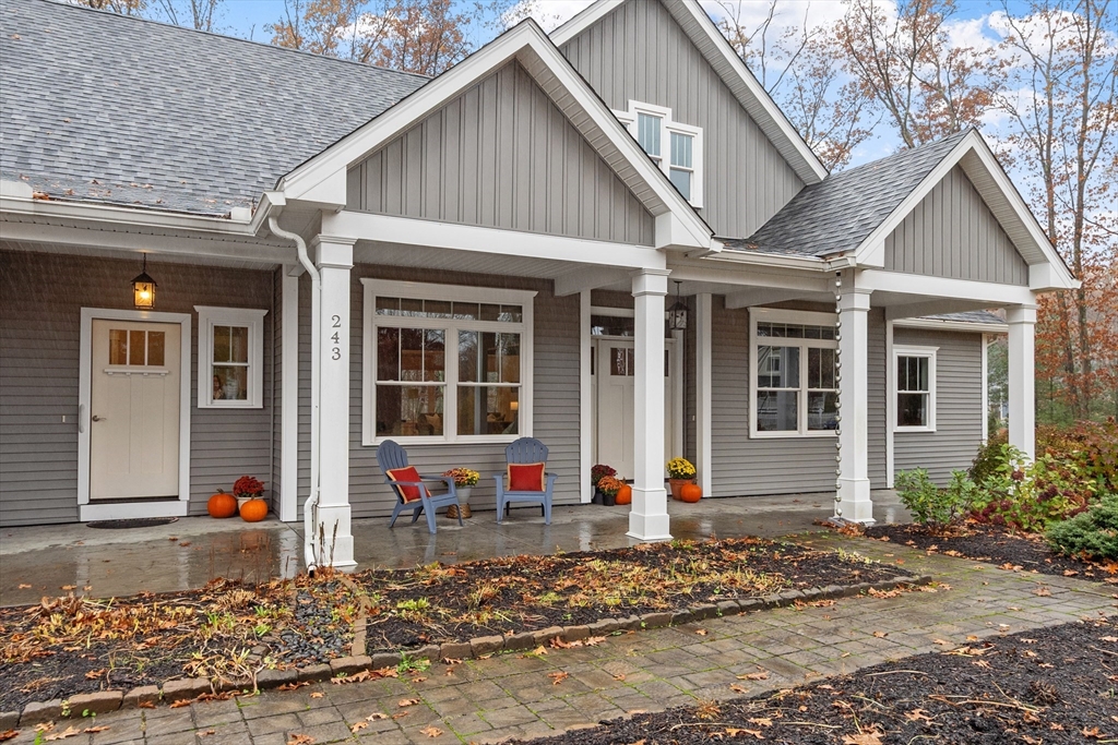 243 Gates Pond Road Berlin, MA 01503 - Photo 3 of 40 a front view of a house with a yard