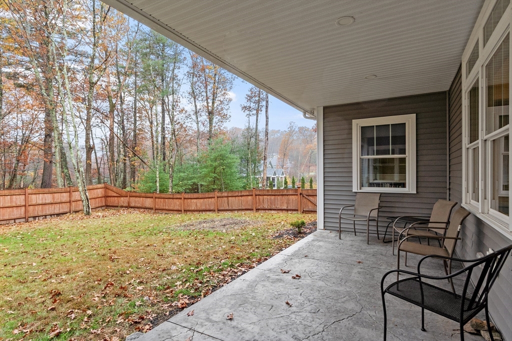 243 Gates Pond Road Berlin, MA 01503 - Photo 36 of 40 a view of a backyard with a patio