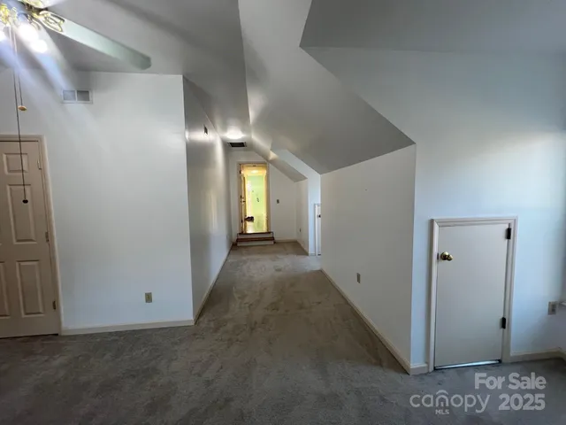 a view of a hallway with closet area