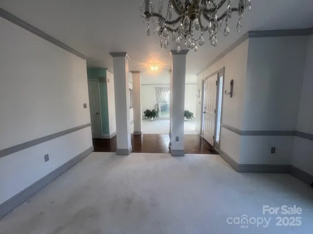 a view of a big room with a chandelier