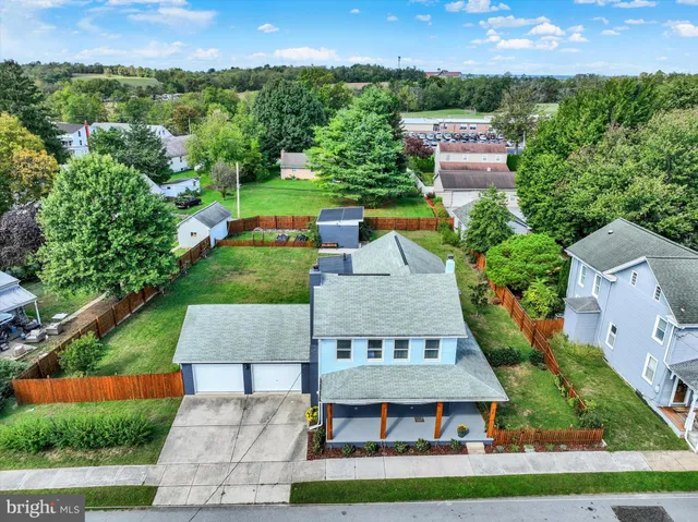 an aerial view of a house with a garden
