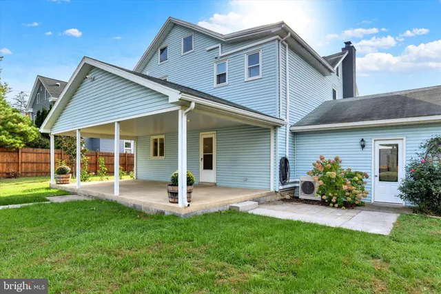 a front view of house with a garden and patio