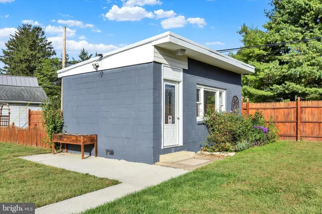 a backyard of a house with seating space