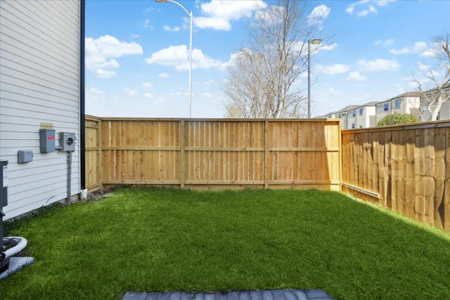 a view of a chair and tables in the yard