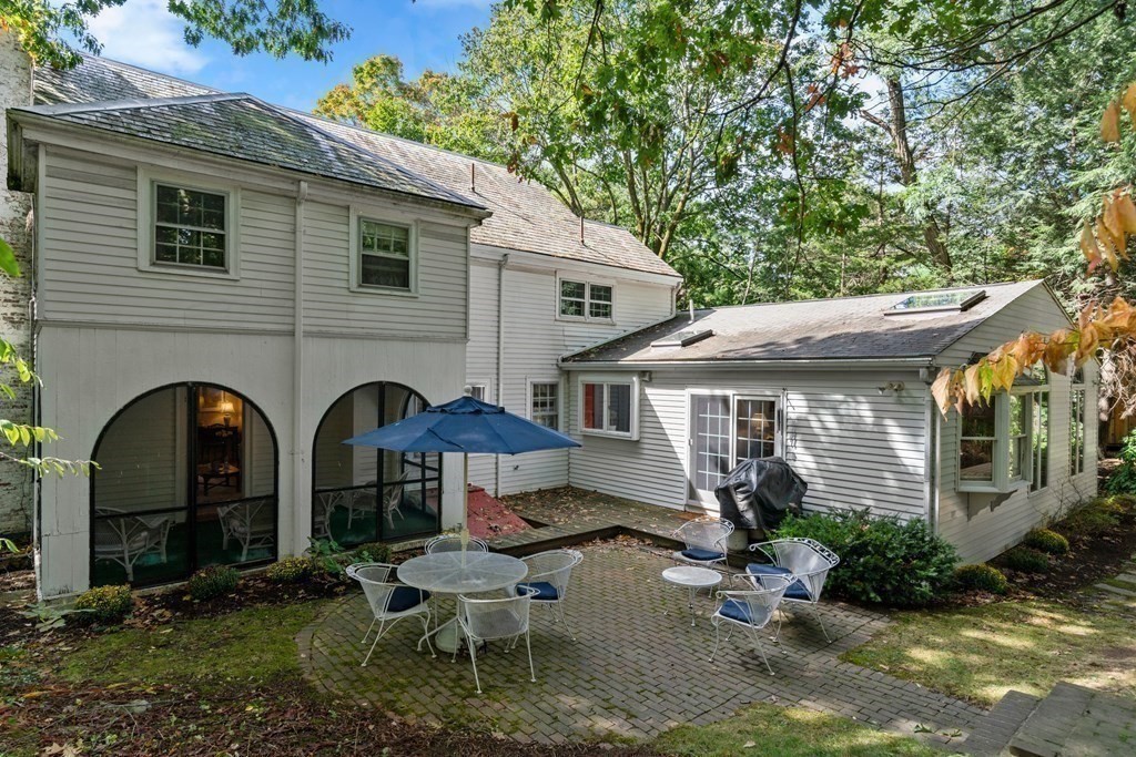 37 Fox Hill Road Wellesley, MA 02481 - Photo 21 of 26 a front view of house with yard and outdoor seating