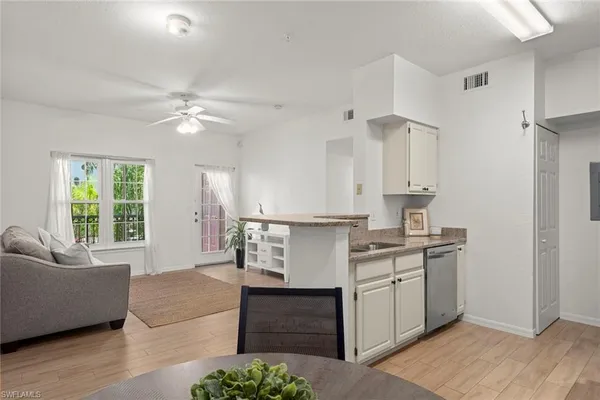 a kitchen with a stove a sink and a refrigerator