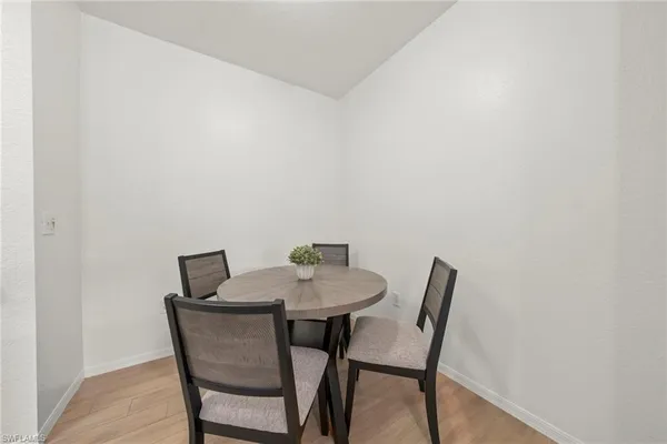 a view of a dining room with table and a chair