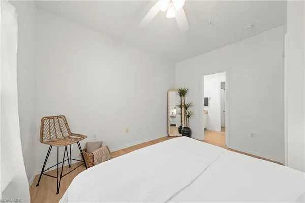 a bedroom with a bed and a chair