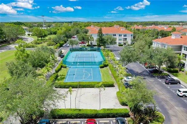 a view of residential houses with outdoor space and lake view