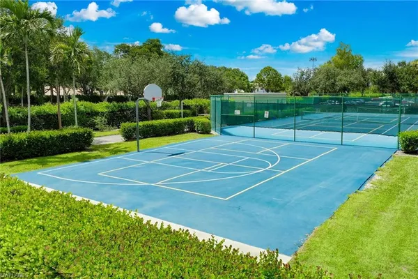 swimming pool view with a seating space and garden view