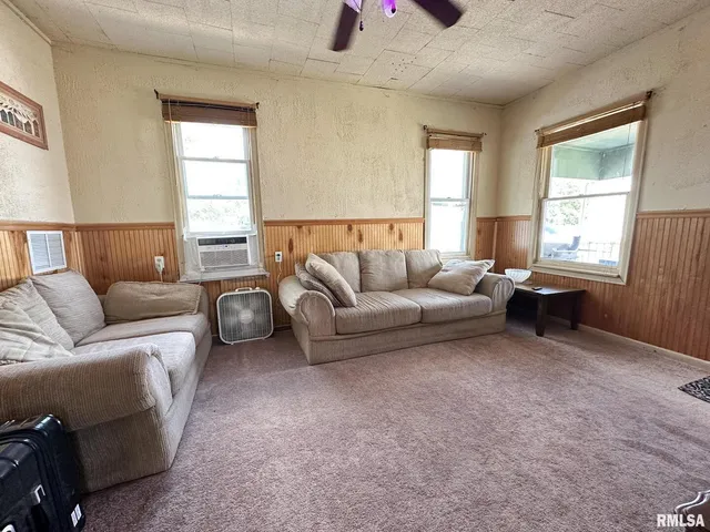 a living room with furniture and a window