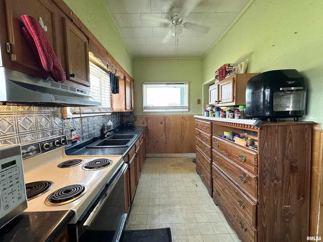 a kitchen with a stove and a microwave