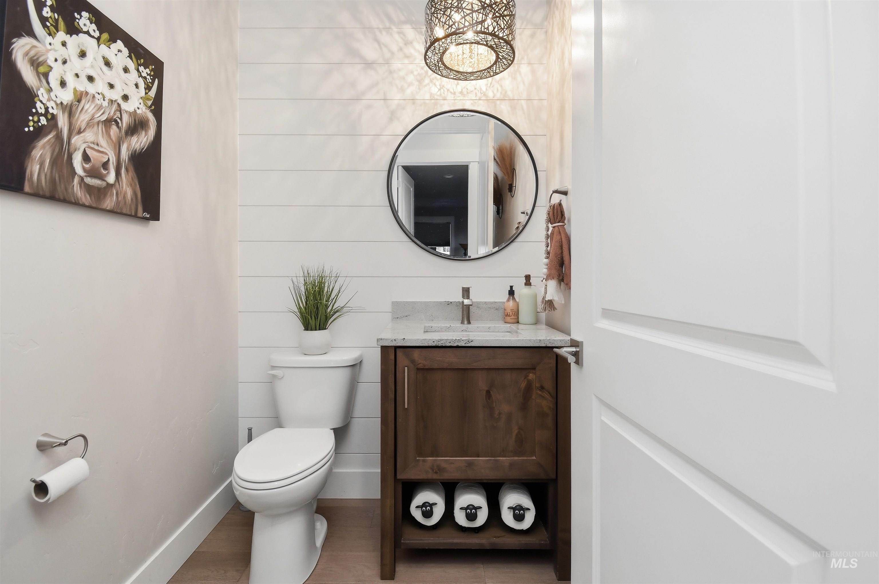12174 West Lacerta Street Star, ID 83669 - Photo 12 of 49 Half bathroom featuring vanity and toilet