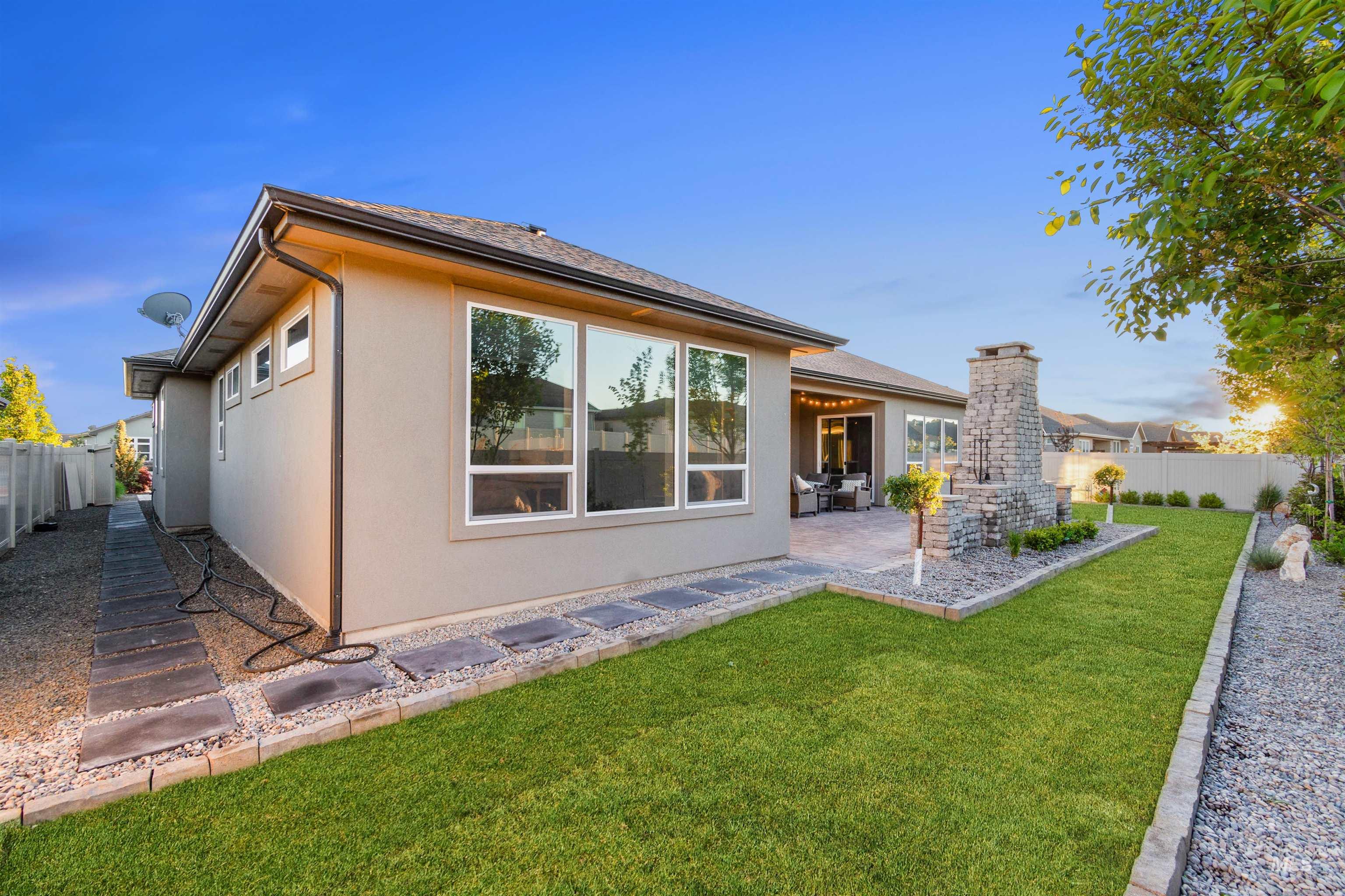 12174 West Lacerta Street Star, ID 83669 - Photo 42 of 49 Back of house with a fenced backyard, stucco siding, and a patio area