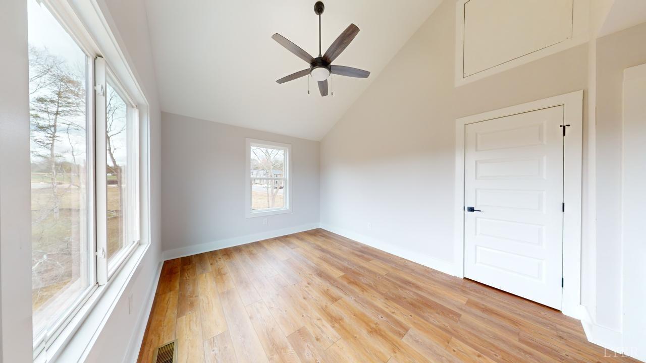 201 Allure Drive Rustburg, VA 24588 - Photo 19 of 46 a view of empty room with wooden floor and fan