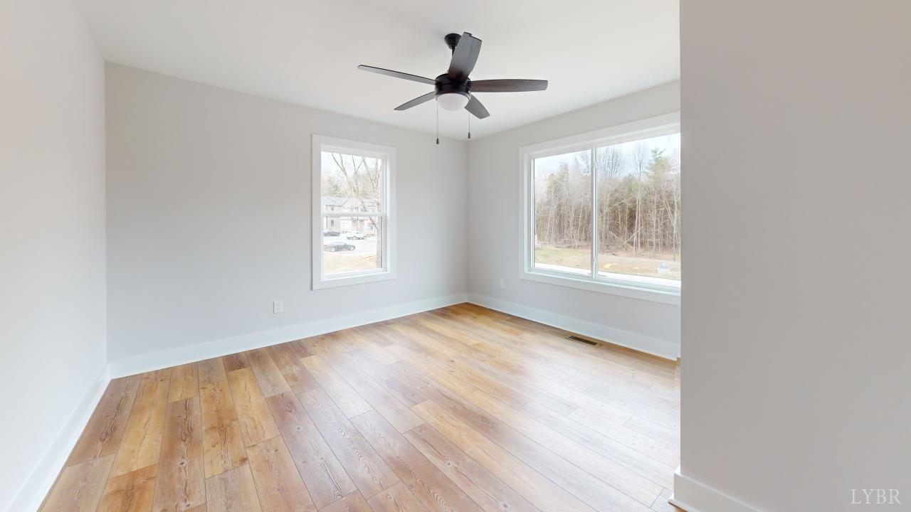 201 Allure Drive Rustburg, VA 24588 - Photo 38 of 46 a view of empty room with wooden floor and fan