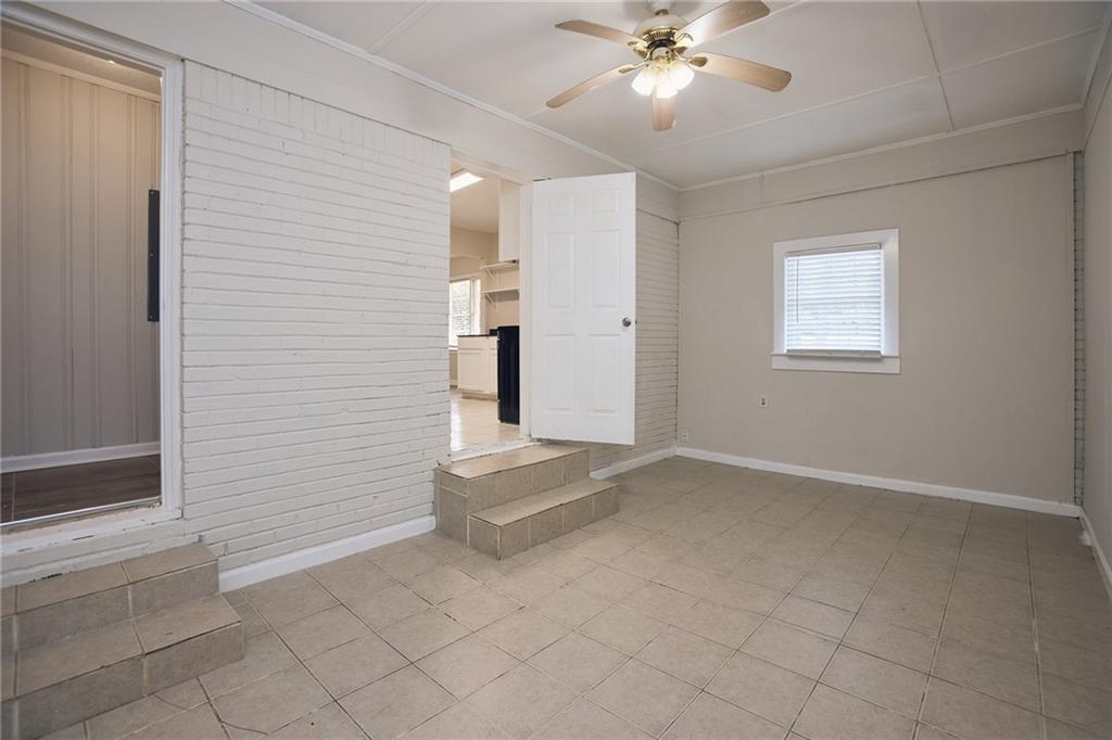 2058 River Road Ellenwood, GA 30294 - Photo 9 of 14 an empty room with fan and windows