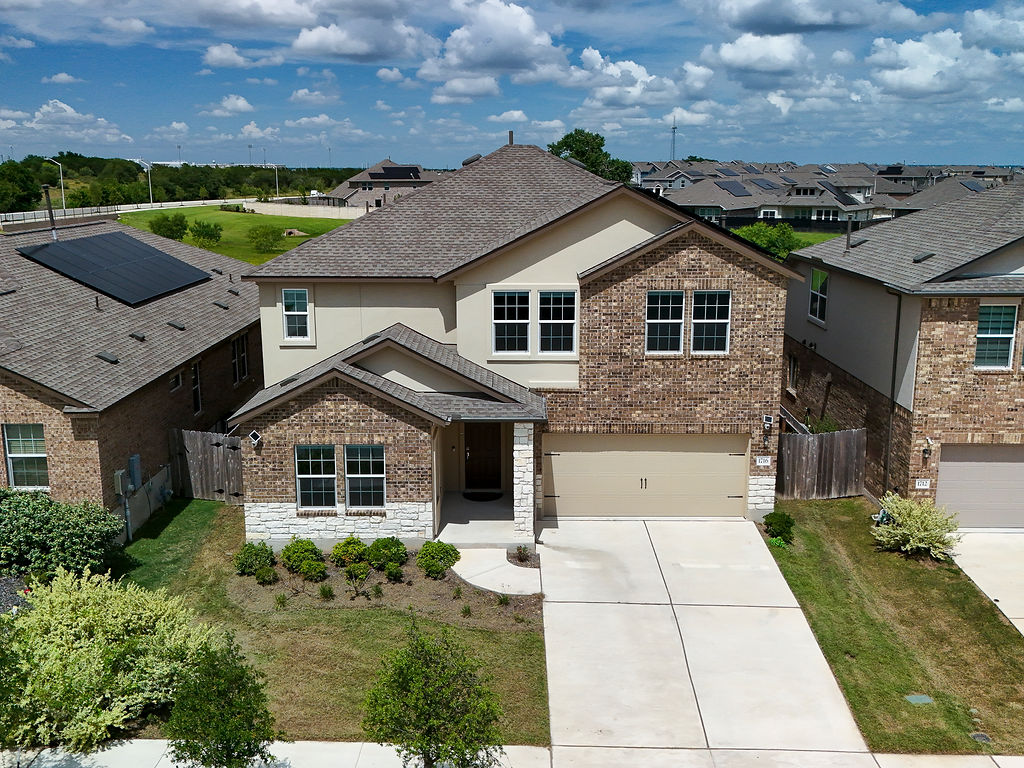1716 Frontenac Street Leander, TX 78641 - Photo 34 of 34 a front view of a house with a yard