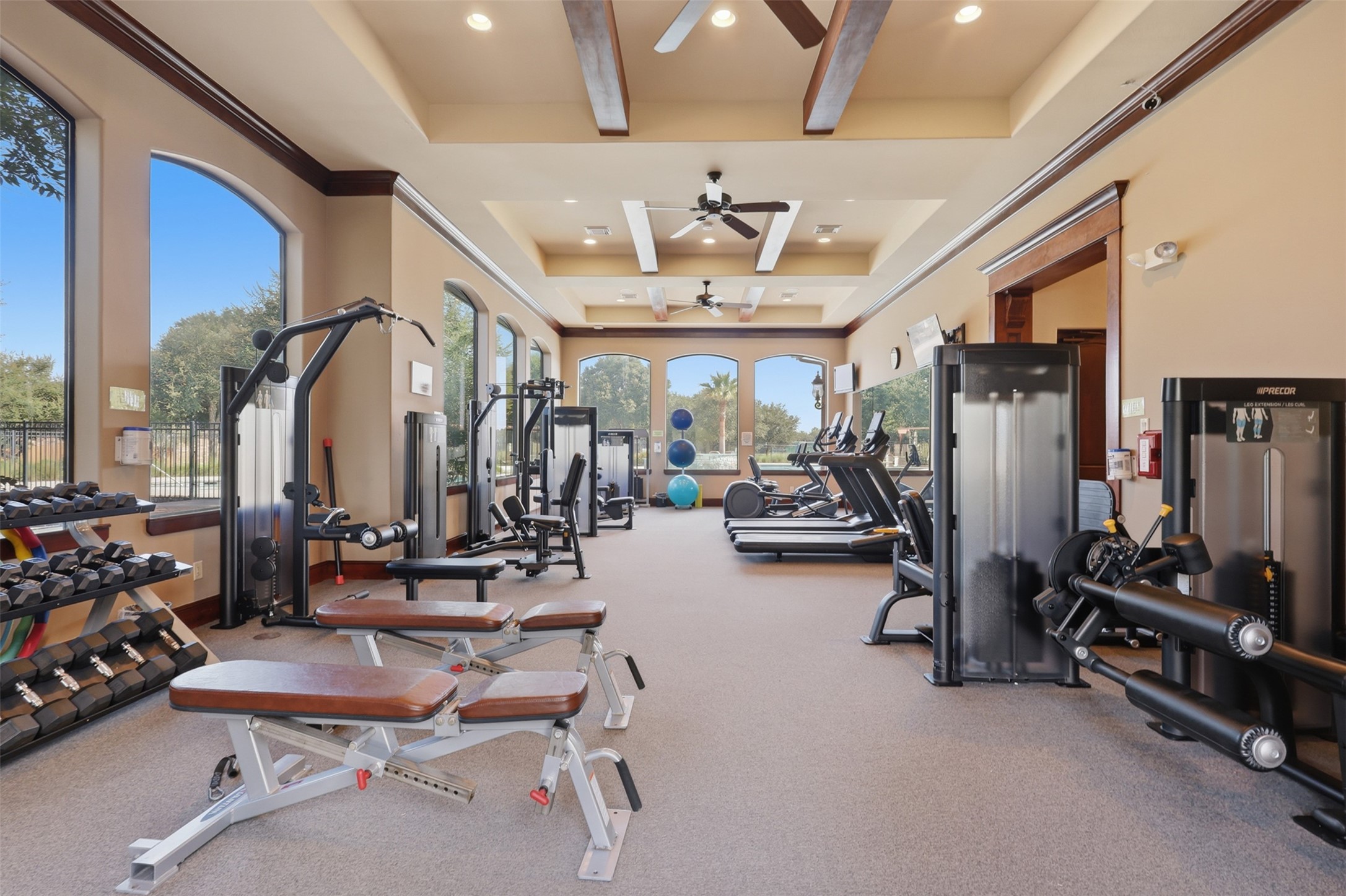 721 Rufina Street League City, TX 77573 - Photo 26 of 33 Stay active without leaving the neighborhood in The Village at Tuscan Lakes' beautifully appointed fitness center. Outfitted with a wide variety of strength-training equipment, free weights, resistance machines, and cardio equipment, this spacious facility offers everything needed for daily workouts.