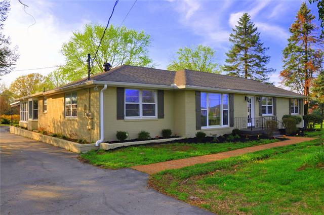1728 Murfreesboro Road Lebanon, TN 37090 - Photo 2 of 20 a front view of a house with a garden and plants