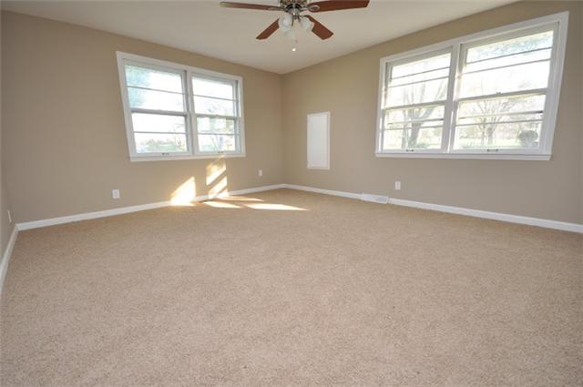 1728 Murfreesboro Road Lebanon, TN 37090 - Photo 11 of 20 an empty room with chandelier fan and windows