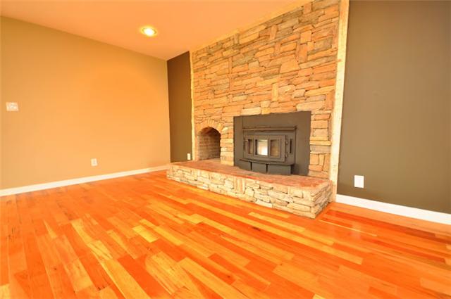 1728 Murfreesboro Road Lebanon, TN 37090 - Photo 5 of 20 a view of an empty room with wooden floor and a fireplace