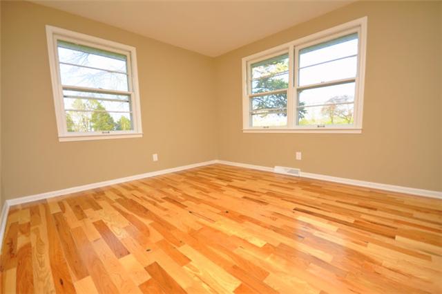 1728 Murfreesboro Road Lebanon, TN 37090 - Photo 6 of 20 a view of an empty room with wooden floor and a window