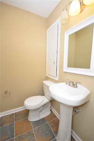 1728 Murfreesboro Road Lebanon, TN 37090 - Photo 7 of 20 a bathroom with a sink a toilet and mirror