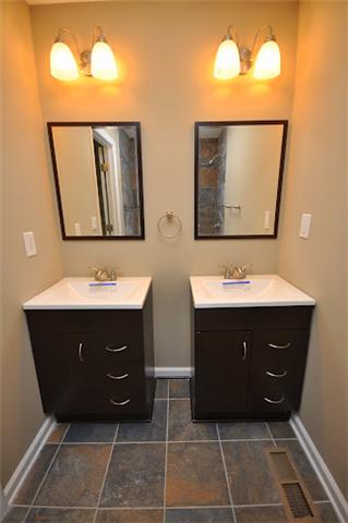 1728 Murfreesboro Road Lebanon, TN 37090 - Photo 9 of 20 a bathroom with a sink vanity and a mirror