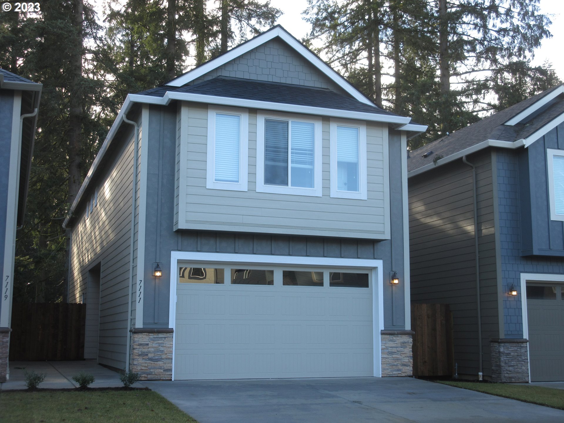 7111 South 13th Street Ridgefield, WA 98642 - Photo 1 of 33 a front view of a house with a garage