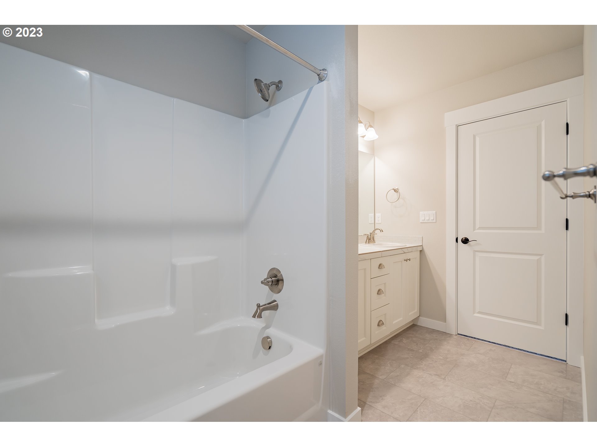 7111 South 13th Street Ridgefield, WA 98642 - Photo 21 of 33 a bathroom with a bathtub and a sink