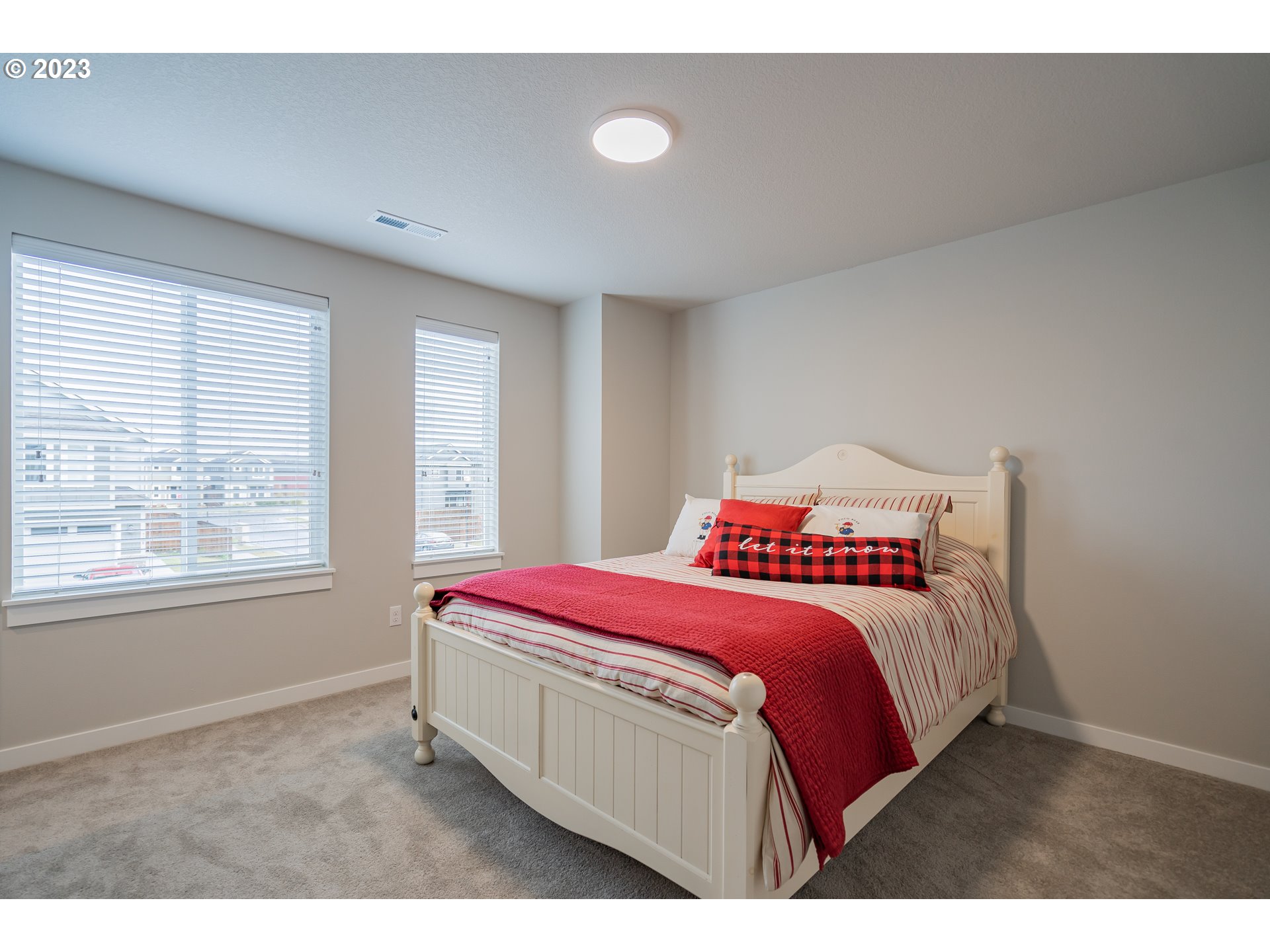 7111 South 13th Street Ridgefield, WA 98642 - Photo 28 of 33 a bedroom with a bed and a window