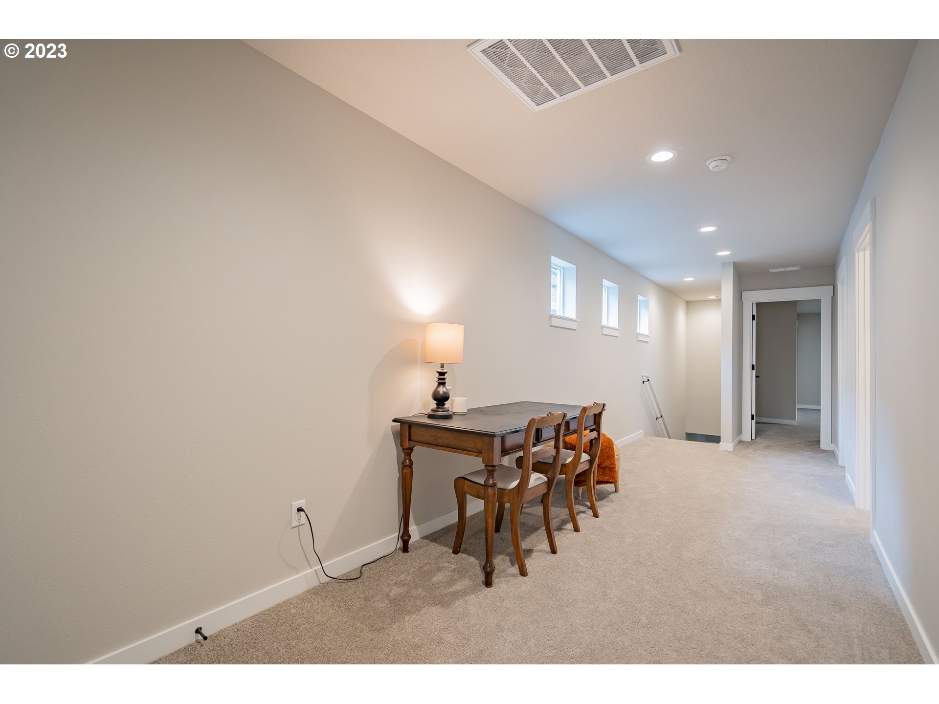 7111 South 13th Street Ridgefield, WA 98642 - Photo 31 of 33 a view of a dining room with furniture and a chandelier