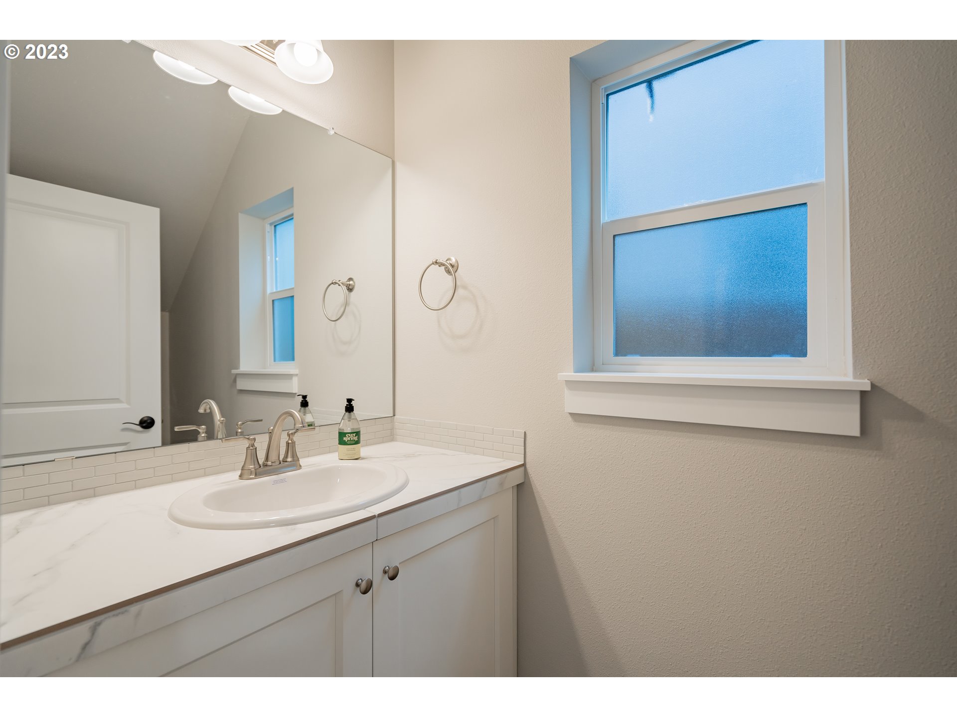 7111 South 13th Street Ridgefield, WA 98642 - Photo 10 of 33 a bathroom with a sink vanity and a mirror