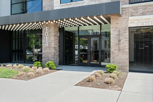 a front view of a building with potted plant